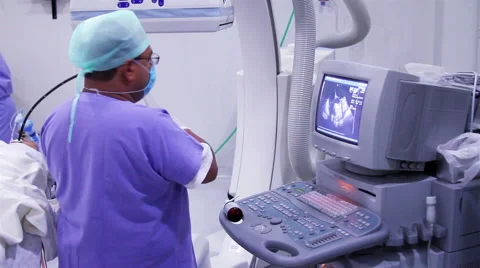 Mexico, 2014: MEDIUM SHOT. Surgeon putting a probe inside the patient. Stock Footage 48207610