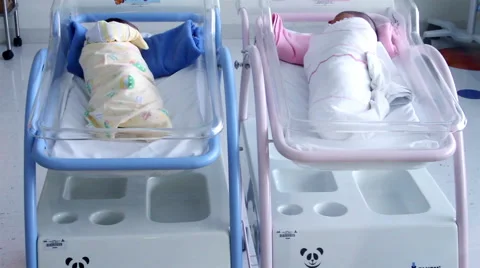Mexico, 2014: MEDIUM SHOT-TILT UP. Newborns in cradles resting. Stock Footage 45018440