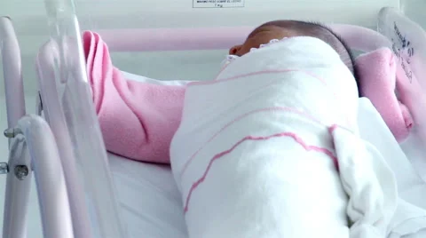 Mexico, 2014: MEDIUM SHOT-TILT UP. Newborns in cradles resting. Stock Footage 45019041