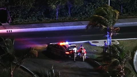 MEXICO, CANCUN - 11 MARCH 2015: Police officers near car at downtown Stock-Footage 309594090