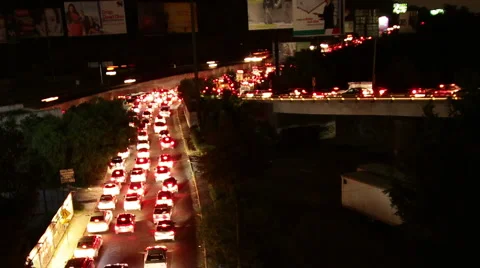 Mexico City night traffic time lapse zoomed Stock Footage