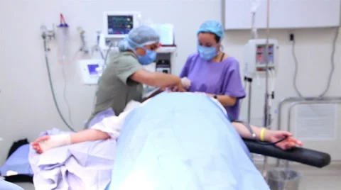 Mexico: CLOSE UP. Nurses prepare a patient's hand for surgery. Stock Footage 48957940