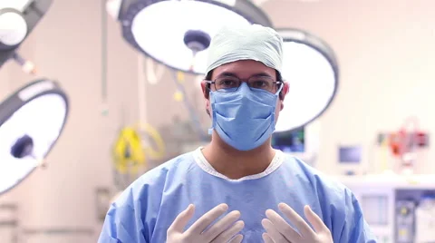 Mexico: MEDIUM SHOT. Surgeon ready for surgery posing for the camera. Stock Footage 48946335