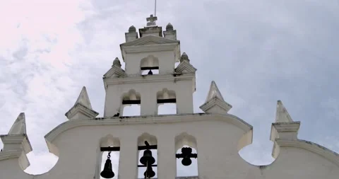 México Mérida Architecture, bells and white facade church Stock Footage 138473442
