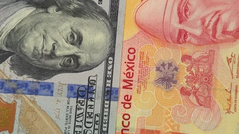 Mexico peso vs US dollar bill rotating. Mexico and USA relations Video stock 105521767