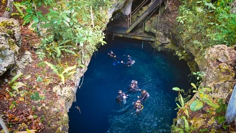Mexico, The Pit cenote in the Riviera Maya - August 7, 2017. Several divers a Stock Footage 90549031