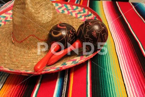 Mexico poncho sombrero maracas background fiesta cinco de mayo decoration bun Stock Photos