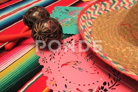 Mexico poncho sombrero maracas background fiesta cinco de mayo decoration bun Stock Photos