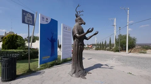 Mexico San Miguel statue with deer head Stock Footage