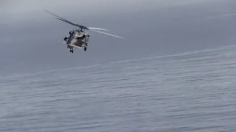 MH-60 Seahawk Fires AGM-114 Hellfire Missiles 007 Stock Footage 166446120