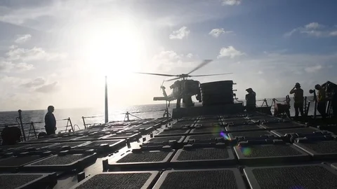 MH-60 Seahawk landing aboard USS Curtis Wilbur Stock Footage 104855722