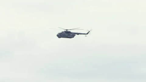 Mi-14PŁ helicopter doing maneuvers at air show in Gdynia Stock Footage 136498240