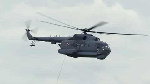 Mi-14PŁ helicopter doing maneuvers at air show in Gdynia Stock Footage 136498332