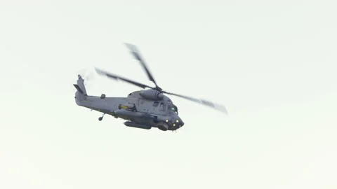 Mi-14PŁ helicopter doing maneuvers at air show in Gdynia Stock Footage 136498487