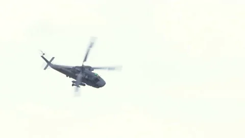 Mi-14PŁ helicopter doing maneuvers at air show in Gdynia Stock Footage 136498814