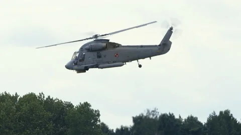 Mi-14PŁ helicopter doing maneuvers at air show in Gdynia Stock Footage 136499032
