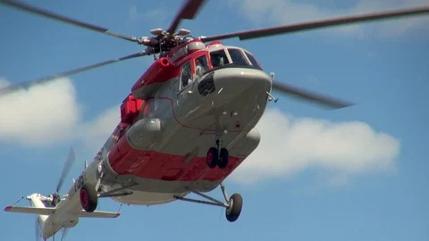 Mi-171 helicopter vertically drops to car parking. Close-up. Video stock 106370266