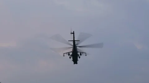 Mi-24 attack helicopter flying away Stock Footage 123291540