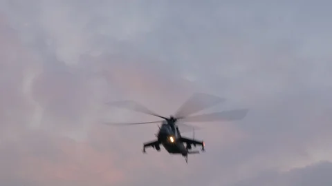 Mi-24 attack helicopter overhead fast fly Stock Footage 123290102