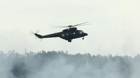 Mi-24 helicopters doing maneuvers at air show in Gdynia Stock Footage 136496836