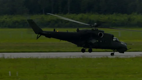 Mi-24 helicopters doing maneuvers at air show in Gdynia Stock Footage 136497500