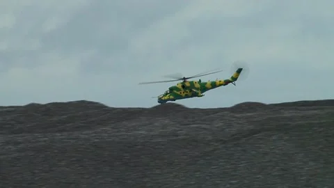 Mi-24 / Mi-35 helicopter (NATO: Hind) dive to low altitude to attack targets. Stock Footage 130645939
