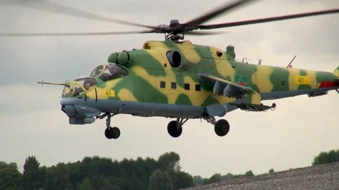 Mi-24 or Mi-35 military helicopter (NATO: Hind) slowly takes off and lands. Stock Footage 123762348