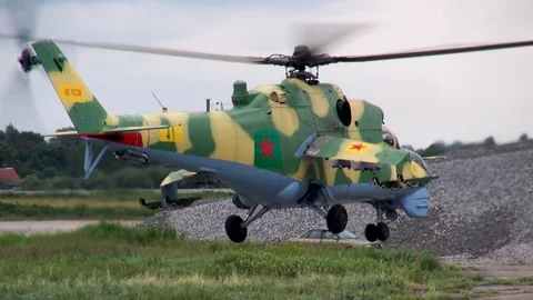 Mi-24 or Mi-35 military helicopter (NATO: Hind) slowly takes off and lands. Stock Footage 123905290