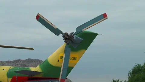 Mi-24/Mi-35 helicopter (Hind) is located on helipad. Blades begin to rotate. Stock Footage 130646053