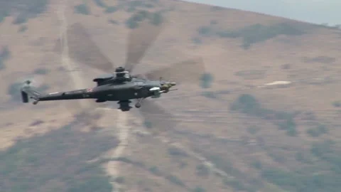 Mi-28N combat helicopter, night hunter flies over waters of Gelendzhik Bay. Stock Footage 134032574