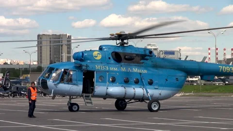 Mi-8 helicopter with rotating blades on background Moscow Ring Road. Stock Footage 106799615