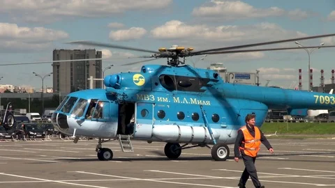 Mi-8 helicopter with rotating blades on background Moscow Ring Road. Stock Footage 106799644