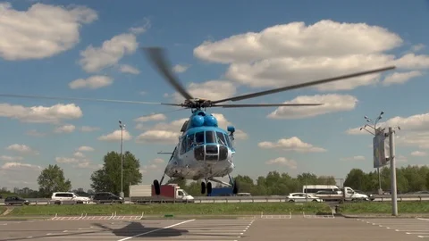 Mi-8 helicopter vertically lands into the parking lot. Close-up. Stock Footage 106553427