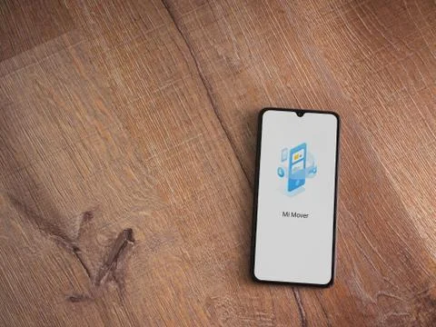 Mi Mover app launch screen with logo on the display of a black mobile smartph Stock Photos
