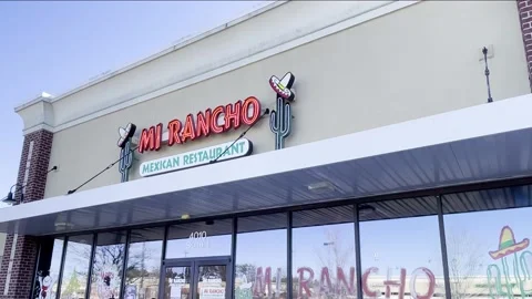 MI RANCHO authentic Mexican restaurant reflections in window tilt down clea.. Stock Footage 228688893