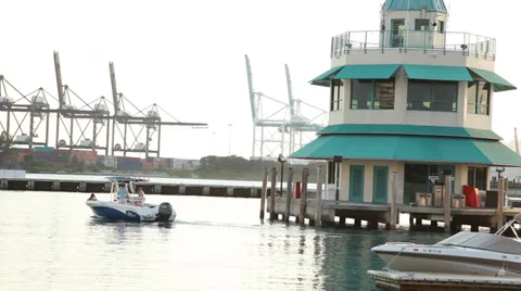 Miami Beach Marina with control tower and harbor cranes - speed boat crosses Stock Footage 39246563