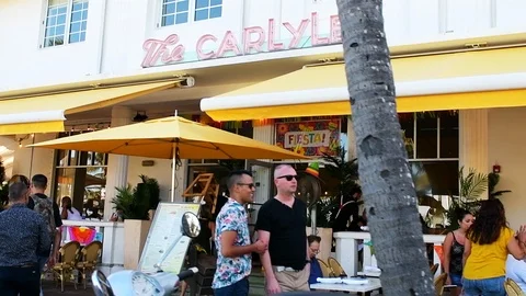 Miami Beach, USA panning driving on South Beach Ocean Drive Carlyle hotel Stock Footage 101752426