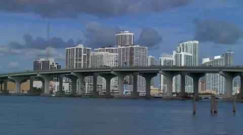Miami downtown skyline seen behind Macarthur Cswy Stock Footage