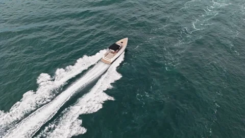 Miami, Florida, USA - June 21, 2025: Luxury boat motor yacht at sea. Yachting Video stock 313759088