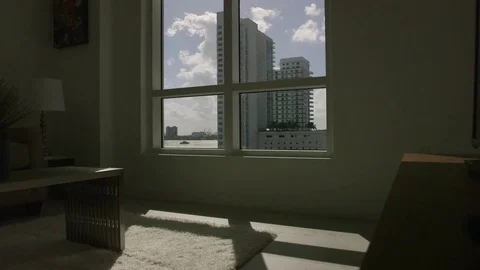 Miami modern apartment timelapse of clouds thru window Stock Footage 69981559