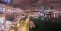 Miami port at night with illuminated buildings in the distance, time-lapse 4k or 4k+ Resolution