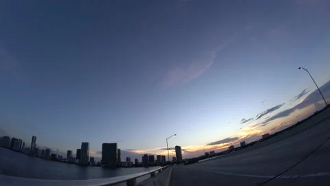 Miami skyline view from Julia Tuttle bridege with flight crossing 库存影片 136019907