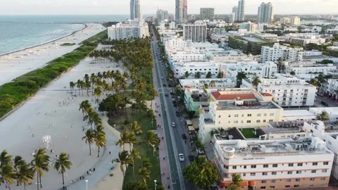 MIAMI-SOUTH BEACH-SUNSET - PUSH SOUTH OVER COLLINS AVE Stock Footage 247461156