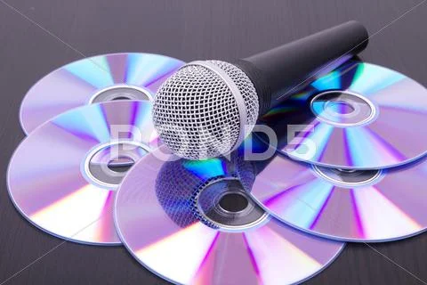 Mic on cd discs Stock Photos