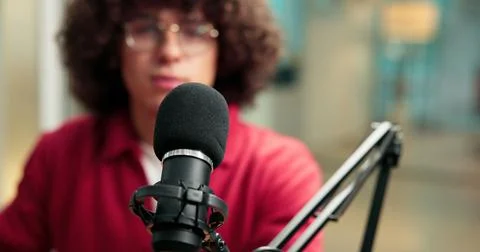 Mic, man and speaking in studio for broadcast update, podcast recording and Stock Photos