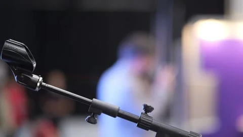 Mic stand isolated against event backdrop Stock Footage 345376839