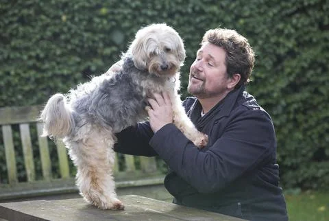 Michael Ball And His Bionic Dog Freddie The Tibetan Terrier Who Had Pioneering H Stock Photos