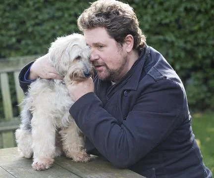 Michael Ball And His Bionic Dog Freddie The Tibetan Terrier Who Had Pioneering H Stock Photos