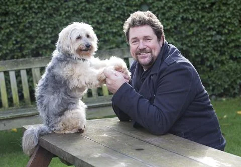 Michael Ball And His Bionic Dog Freddie The Tibetan Terrier Who Had Pioneering H Stock Photos
