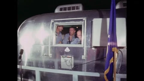 Michael Collins, Buzz Aldrin and Neil Armstrong in mobile quarantine facility Stock Footage 269506550